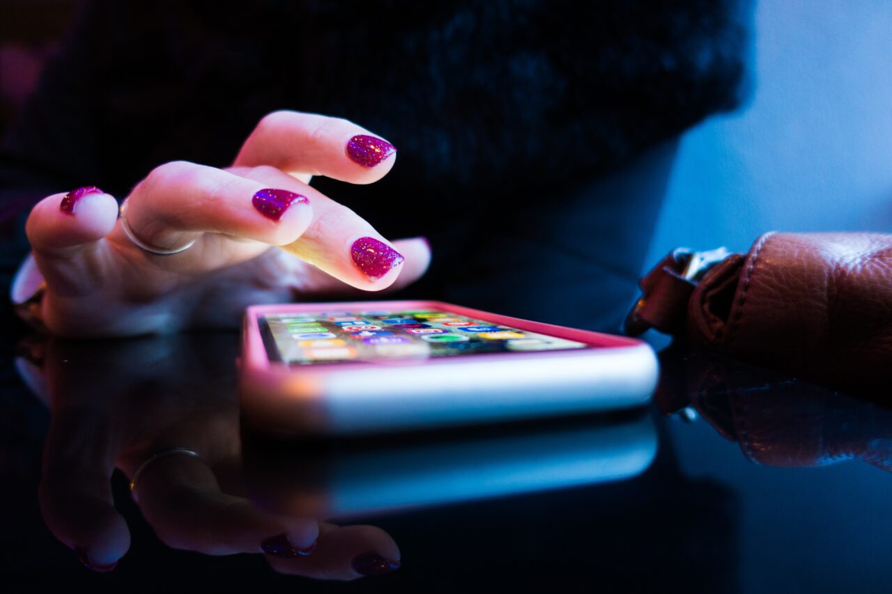 Hand on mobile, app