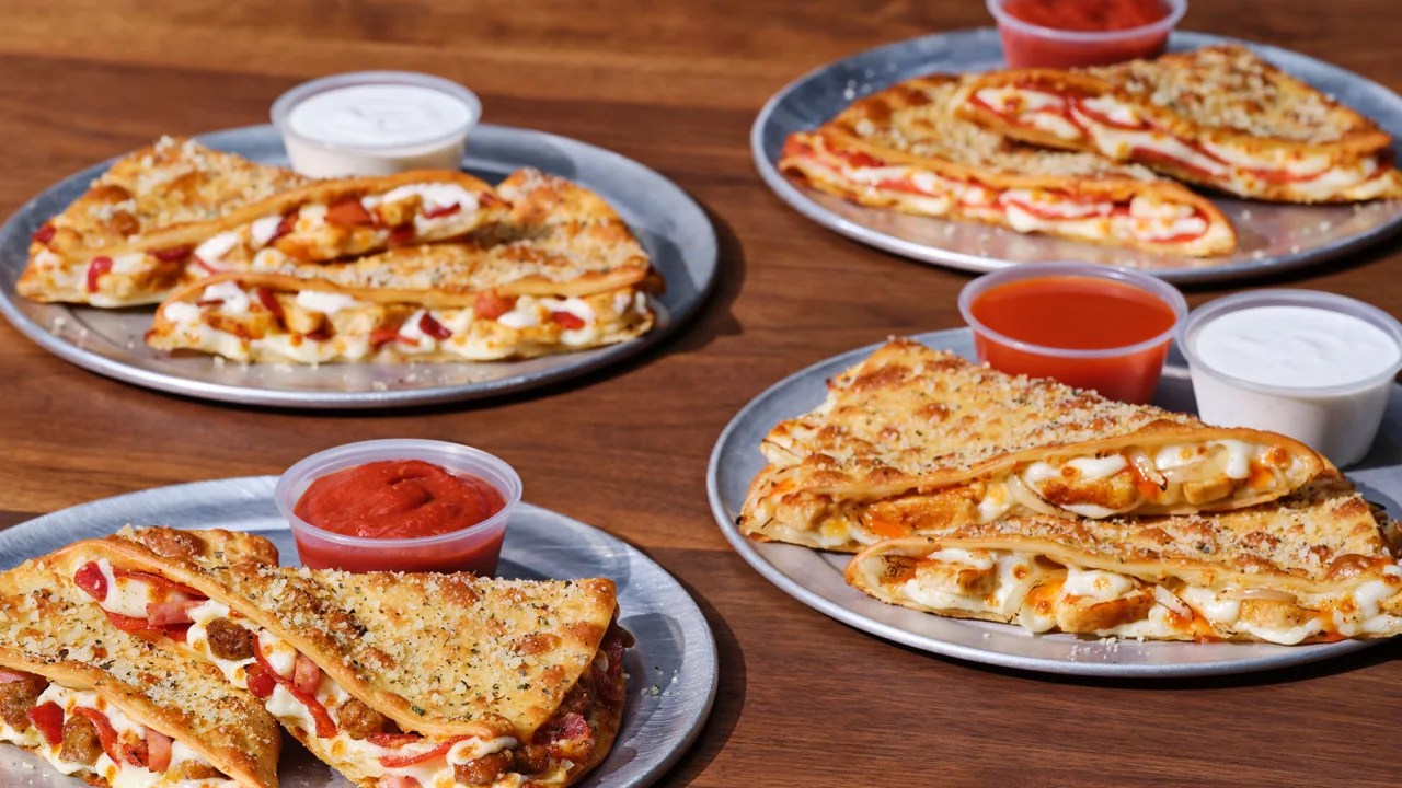 four plates of pizza and souces